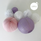 Paper lanterns in shades of lilac, white and light pink for nursery decor