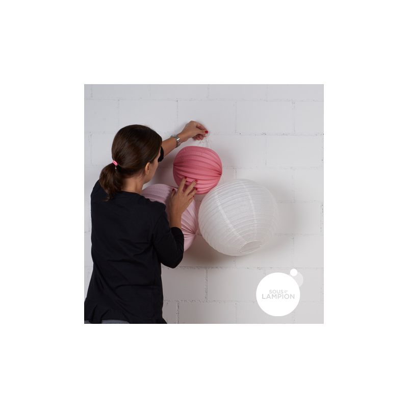 string and hook to hang paper lanterns on the wall